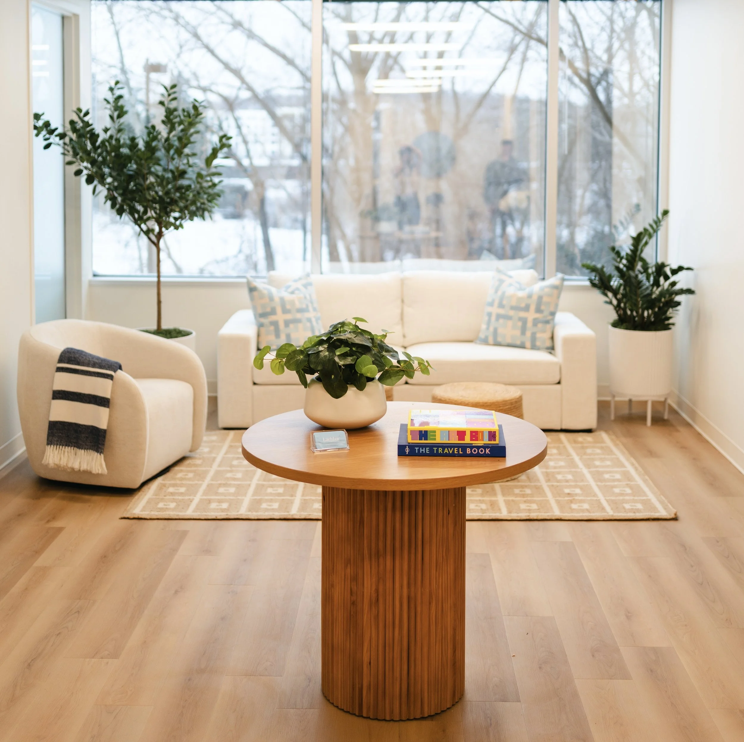 Lachlan’s welcoming Minnetonka office with comfortable seating, plants, and books
